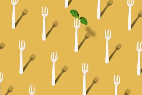 Pattern made with many eco friendly wooden fork with trendy shadows and green Stock Photos