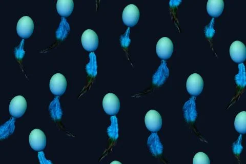 Pattern made of natural blue colored eggs and feather in spermatozoid shape on Stock Photos