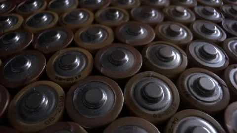 Pattern made from old alkaline batteries. The camera moves from above. Stock Footage 162372608