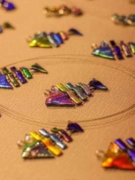 A pattern made out of colored glass shards on a table Foto stock