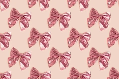 Pattern made of pink bow with sequins. Stock Photos