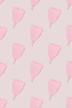 Pattern made of pink menstrual cup. 스톡 사진