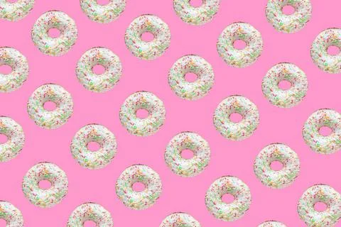 Pattern made of ring donuts Pattern made of ring donuts with white glaze a... Stock Photos