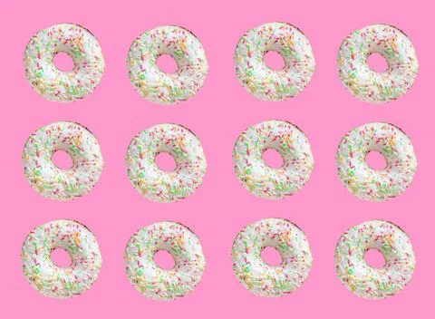 Pattern made of ring donuts Pattern made of ring donuts with white glaze a... Stock Photos