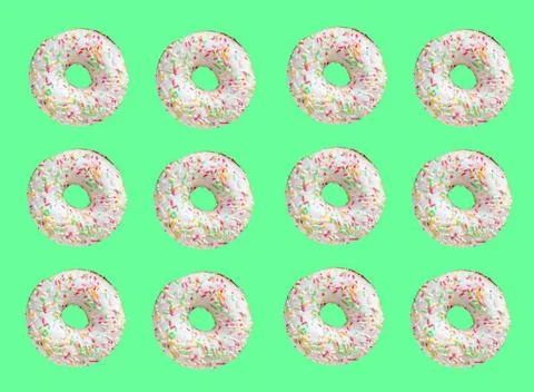 Pattern made of ring donuts Pattern made of ring donuts with white glaze a... Stock Photos