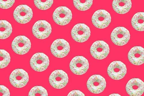 Pattern made of ring donuts Pattern made of ring donuts with white glaze a... Stock Photos