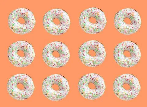 Pattern made of ring donuts Pattern made of ring donuts with white glaze a... Stock Photos