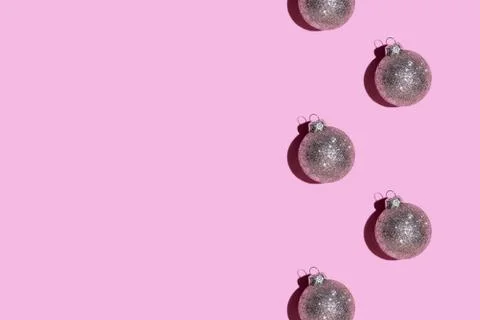 Pattern made of silver balls on pink background. Stock Photos