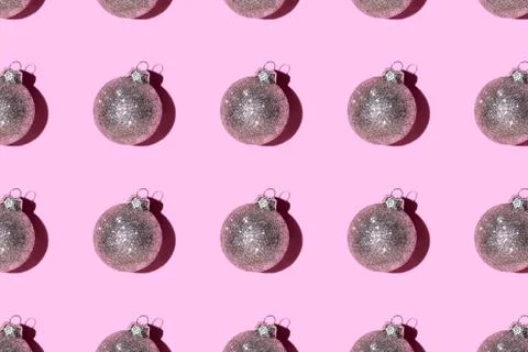 Pattern made of silver balls on pink background. Stock Photos
