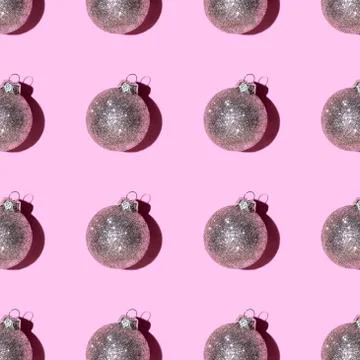 Pattern made of silver balls on pink background. Stock Photos
