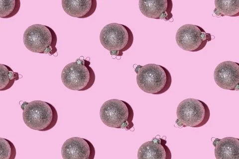 Pattern made of silver balls on pink background. Stock Photos