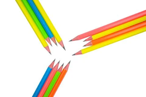 Pattern made with twelve different colored wood pencil crayons on white paper Stock Photos