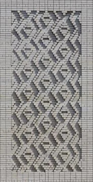 A pattern made of white bricks in the form of diamond shapes. Decoration of t Stock Photos