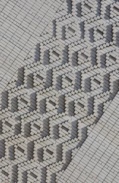A pattern made of white bricks in the form of diamond shapes. Decoration of t Foto stock