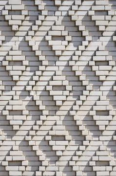 A pattern made of white bricks in the form of diamond shapes. Decoration of t Foto stock