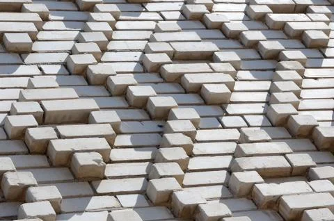 A pattern made of white bricks in the form of diamond shapes. Decoration of t 스톡 사진