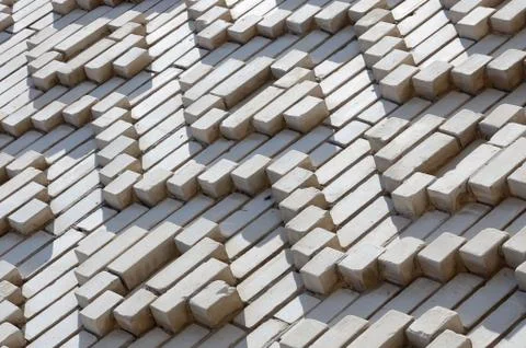 A pattern made of white bricks in the form of diamond shapes. Decoration of t 스톡 사진