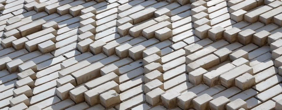 A pattern made of white bricks in the form of diamond shapes. Decoration of t 스톡 사진