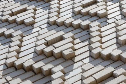 A pattern made of white bricks in the form of diamond shapes. Decoration of t Stock Photos