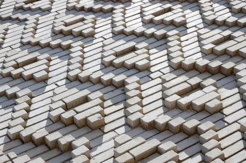 A pattern made of white bricks in the form of diamond shapes. Decoration of t Stock Photos