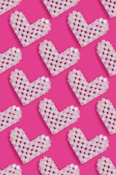 Pattern made from white hearts. Figurine made from acrylic beads. Stock Photos