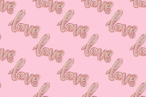 Pattern made of Word Love. Foil inflatable balloon on a pink background. Stock Photos