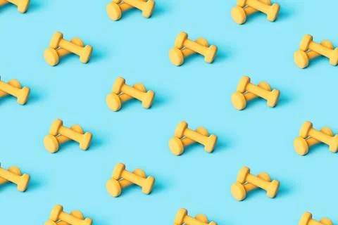 Pattern made of yellow dumbbells. Stock Photos