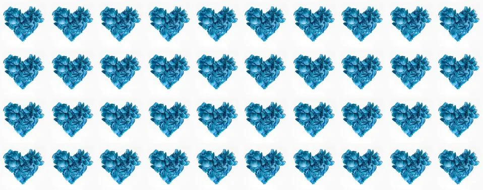 Pattern of many flower petals in shape of hearts isolated on white background. Stockfoto's