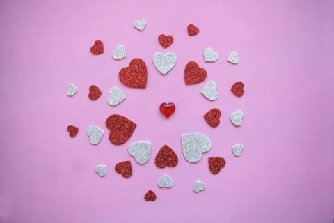 Pattern of many hearts on a pink background Stock Photos