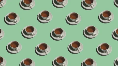 Pattern with many tea cups on saucers animated on green background Stock Footage 134401097