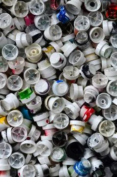 A pattern of many used and soiled nozzles from spray cans with aerosol paint. Stock Photos