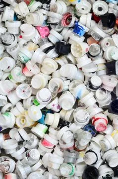 A pattern of many used and soiled nozzles from spray cans with aerosol paint. Stock Photos