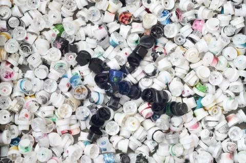 A pattern of many used and soiled nozzles from spray cans with aerosol paint. Stock Photos