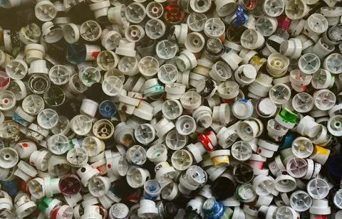 A pattern of many used and soiled nozzles from spray cans with aerosol paint Stock Photos