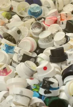 A pattern of many used and soiled nozzles from spray cans with aerosol paint Stock Photos