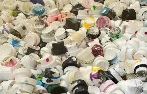 A pattern of many used and soiled nozzles from spray cans with aerosol paint Stock Photos