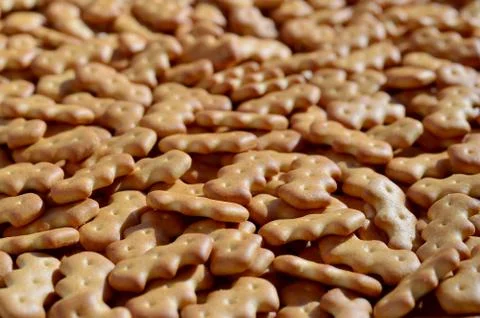 Pattern of a many yellow salted crackers Stock Photos
