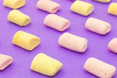 Pattern with marshmallows on violet background Stock Photos