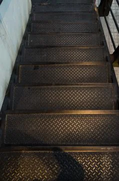 Pattern of metallic material black steps with a background of a city. concept Stock Photos
