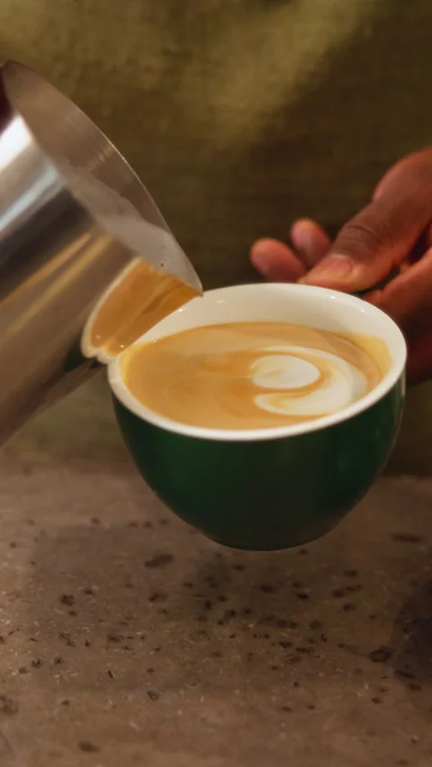 Pattern, milk and hands of person in coffee shop, restaurant and prepare for Stock Footage 337472716