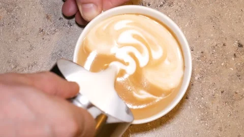 Pattern of milk on coffee. Видео 111469011