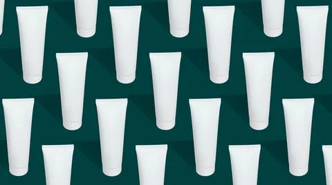Pattern from mock up cosmetic or toothpaste tubes on green background Stock Photos