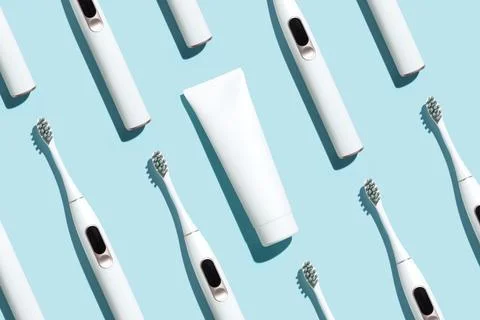 Pattern from mock up toothbrush and toothpaste on blue background Stock Photos