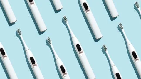 Pattern from mock up toothbrush on blue background Stock Photos