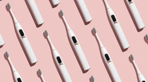 Pattern from mock up toothbrush on pink background Stock Photos