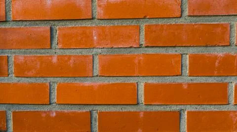 Pattern of a Modern wall made of cement and orange bricks, Construction indus Stock Photos