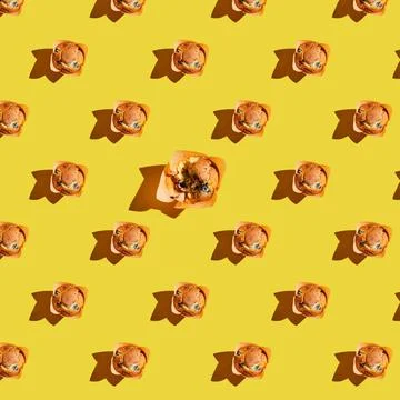A pattern of muffins with one bitten off on a Stock Photos
