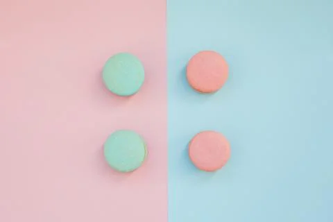Pattern Of Multi-Colored Macaroons On A Blue and pink Background.top view. Fl Stock Photos