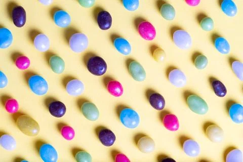 Pattern of multi-colored sweets in the form of pebbles Stock Photos