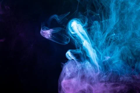 Pattern, Neon pink, blue  and  purple smoke in the  on a dark isolated backgr Foto stock